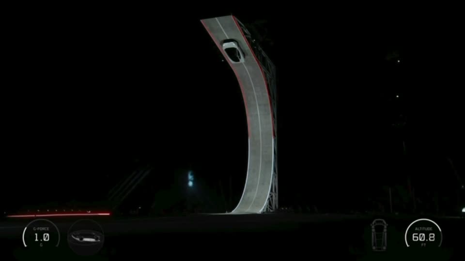At the top, upside down, where the ramp bends past vertical (60.8 ft).