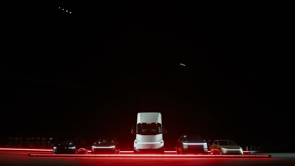 The line-up before the jump: the Semi in the middle, a Cybertruck and a Cybercab on the right.